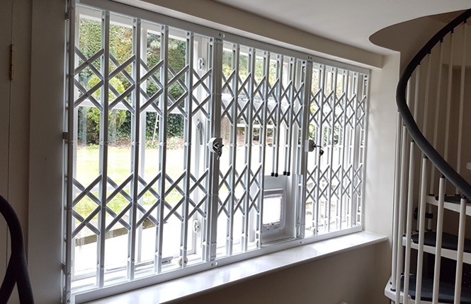 RSG1000 retractable window security grilles fitted to a house in Ilford..