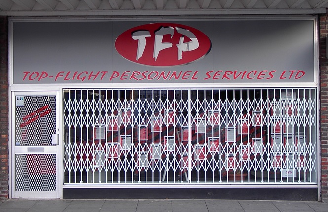 RSG1000 retractable security grilles securing a commercial retail outlet in West Essex.