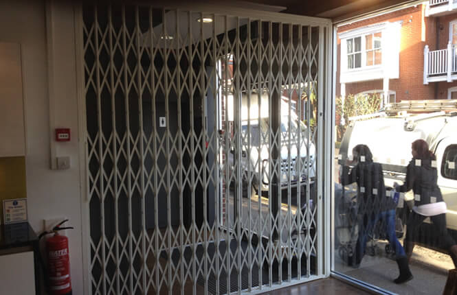 RSG1000 retractable security grille securing shop front in London West-End.