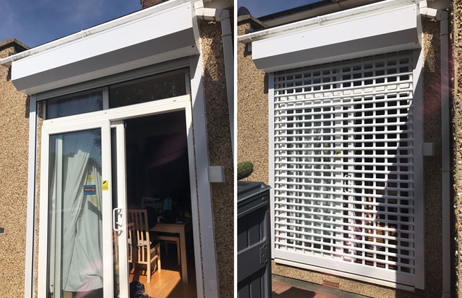 RSG5100 domestic shutter with punched lath and powder coated white fitted on a patio door at rear of a property.
