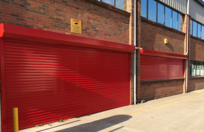 RSG5600 commercial security roller shutters on DHL warehouse in Essex.