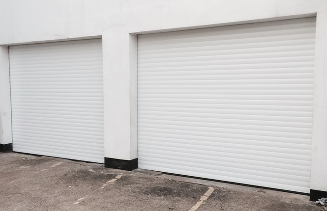 RSG7000 electrically operated security roller garage doors installed on a mechanic workshop in Sutton.
