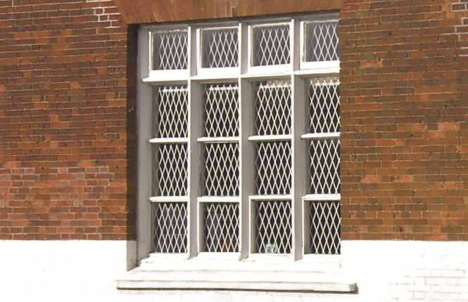 RSG800 fixed mesh grilles on residential window in Hackney.