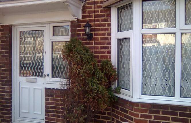 RSG800 fixed mesh grilles securing windows and doors on a residential property in Wimbledon.